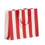 shopper in carta lusso con fantasia a righe bianco e rosso e maniglia in grosgrain rossa